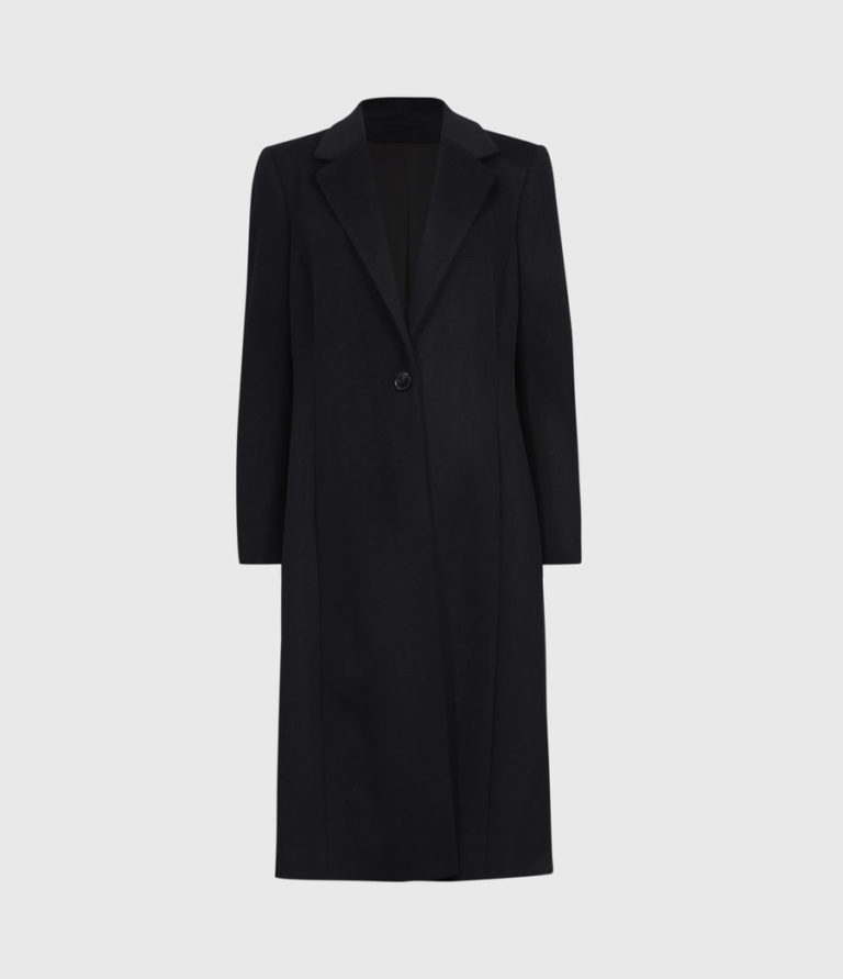 Vancouver & NYC Best Personal Stylist Devina Bhaga styling a women's coat for winter